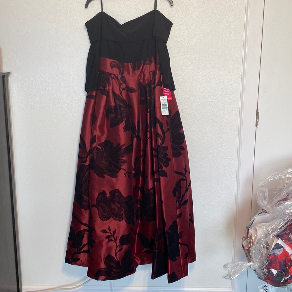 Black and red Jessica Howard brand ball gown. Of the shoulder size 16.
